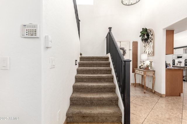 stairway featuring tile patterned floors