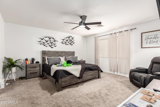 bedroom featuring ceiling fan and carpet