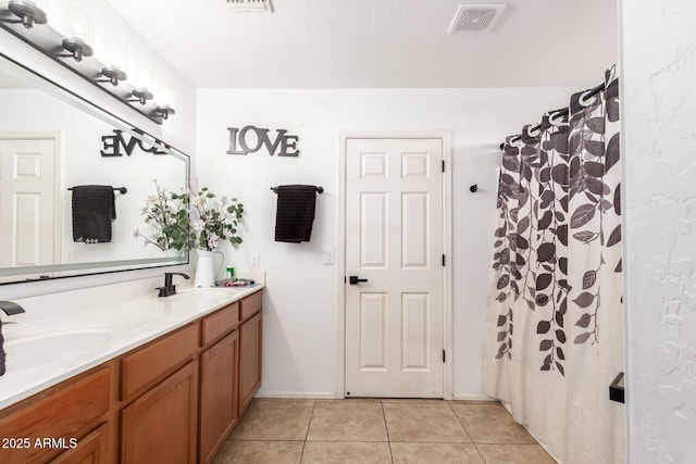 bathroom with vanity, tile patterned floors, and a shower with curtain