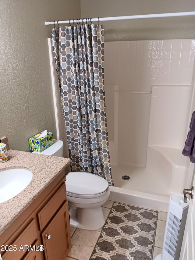 bathroom with toilet, vanity, and a shower with curtain