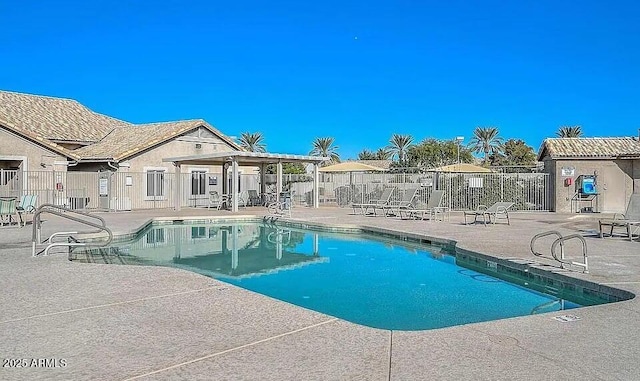 view of swimming pool featuring a patio