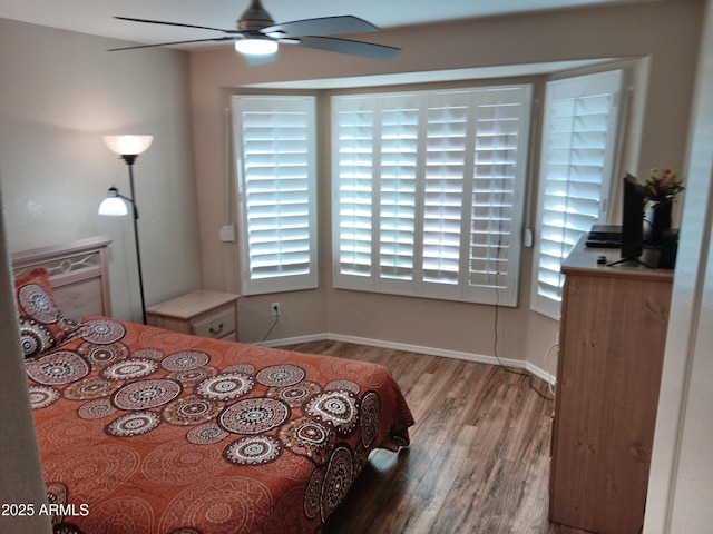 bedroom featuring ceiling fan and hardwood / wood-style flooring