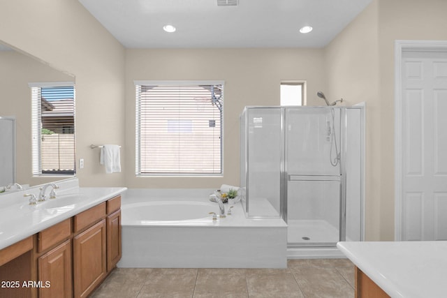 bathroom featuring tile patterned floors, vanity, and independent shower and bath