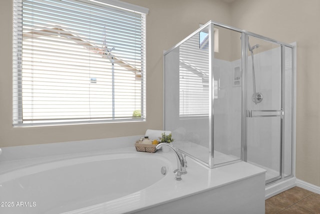 bathroom featuring tile patterned flooring and plus walk in shower