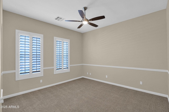 spare room with ceiling fan and carpet floors