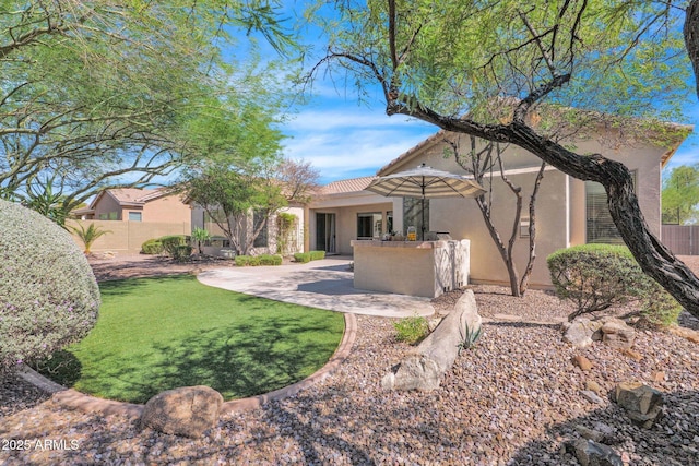 rear view of property featuring a patio area