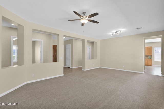 carpeted empty room with ceiling fan