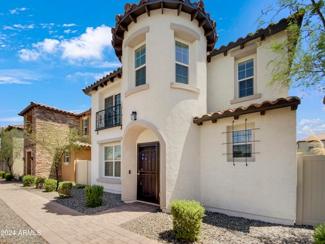 mediterranean / spanish-style house with a balcony