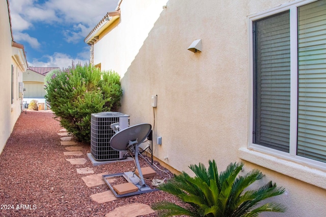 view of side of home with cooling unit