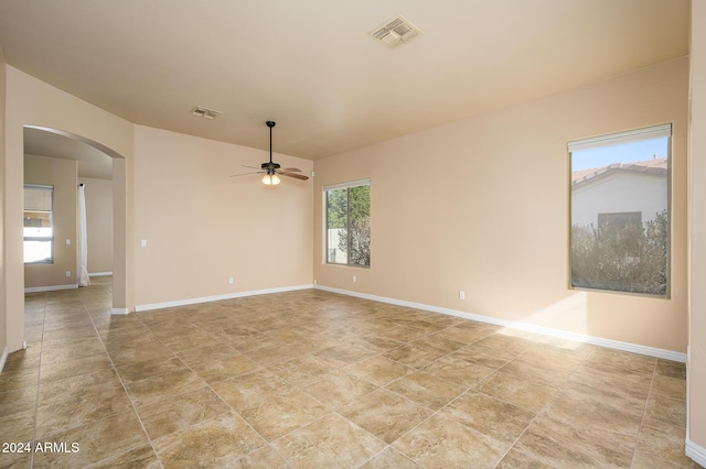 unfurnished room with ceiling fan