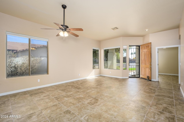 unfurnished room with a wealth of natural light and ceiling fan