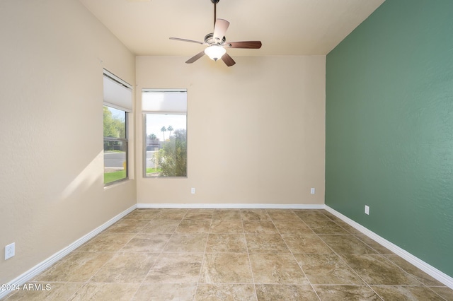 unfurnished room with ceiling fan