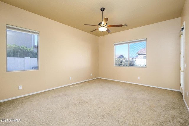 unfurnished room featuring carpet and ceiling fan