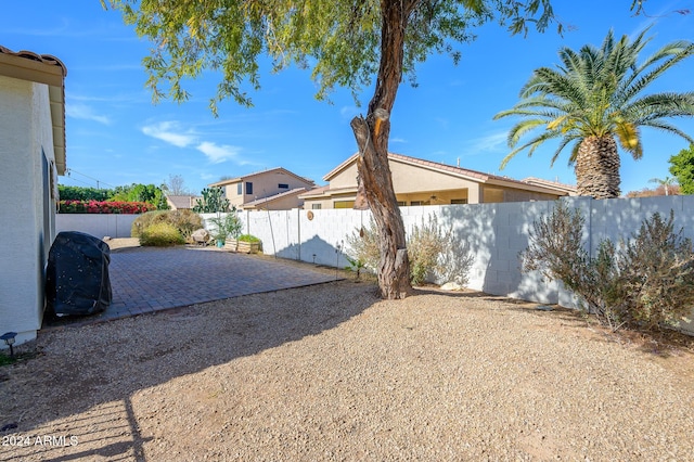 view of side of home with a patio