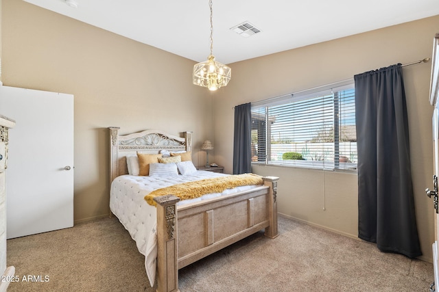 bedroom featuring light carpet, visible vents, and an inviting chandelier