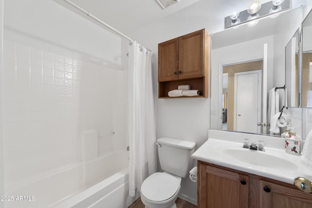 bathroom featuring shower / bath combination with curtain, visible vents, vanity, and toilet