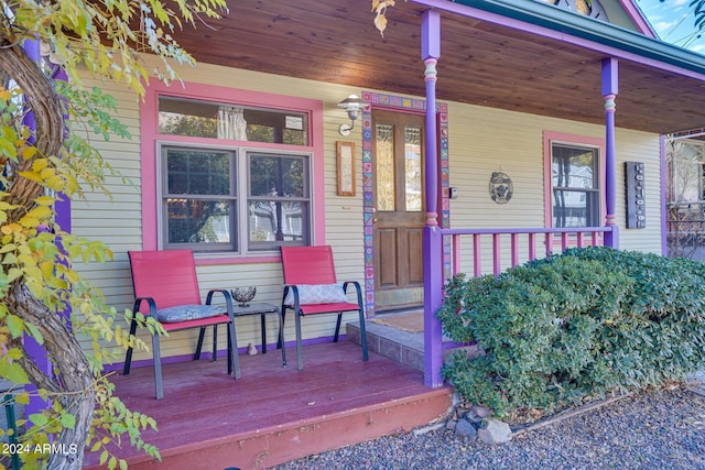 view of exterior entry with covered porch