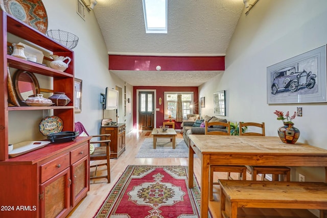 foyer featuring a textured ceiling and light wood-style flooring
