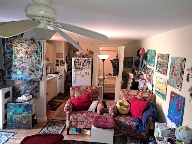 living room featuring wood finished floors and ceiling fan