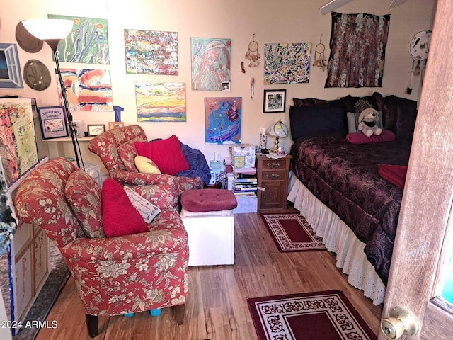 bedroom featuring wood finished floors