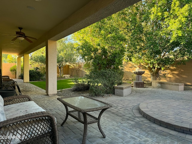 view of patio featuring ceiling fan