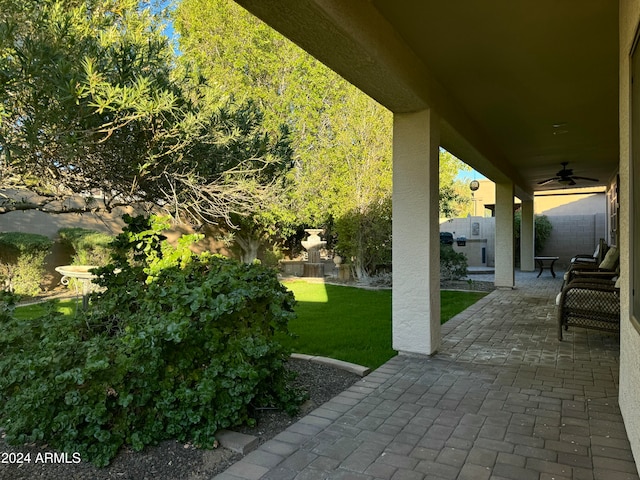 view of patio featuring ceiling fan