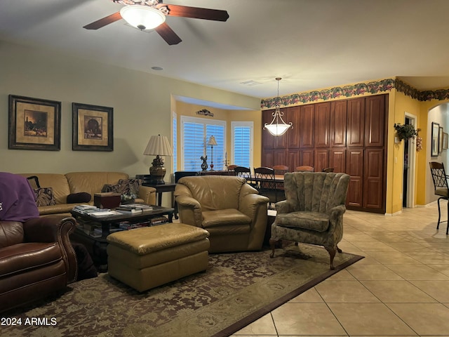 living room with ceiling fan and light tile patterned flooring