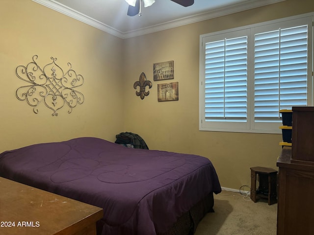 bedroom featuring ceiling fan, light colored carpet, and ornamental molding