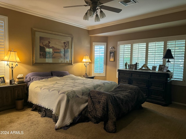 bedroom featuring ceiling fan, ornamental molding, and light carpet