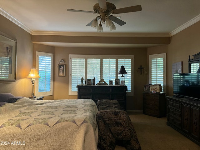 bedroom featuring ceiling fan, crown molding, and carpet