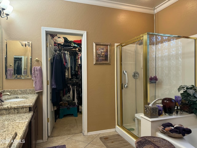 bathroom featuring tile patterned floors, vanity, an enclosed shower, and ornamental molding