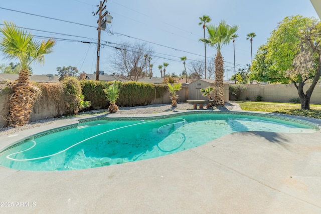 view of pool with a storage unit