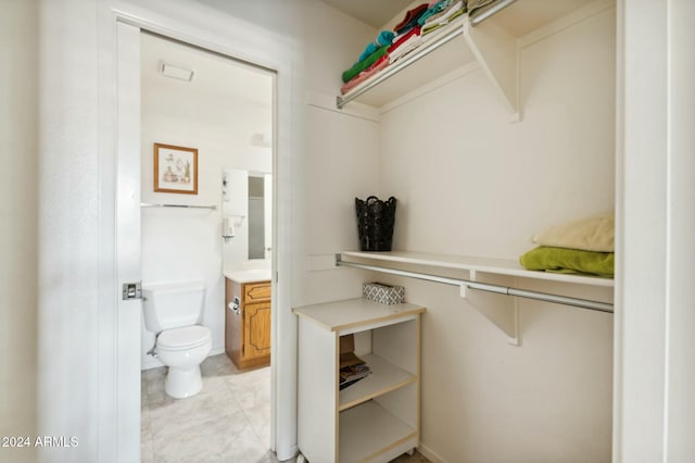 spacious closet with light tile patterned flooring