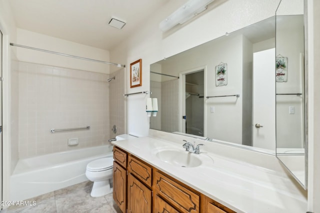 full bathroom with toilet, vanity, tile patterned floors, and tiled shower / bath combo