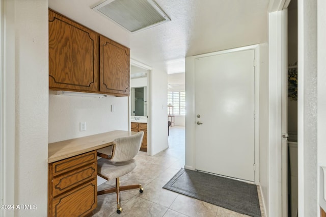 2064 S Farnsworth Dr Unit 39, Mesa, AZ 85209 - office area featuring built in desk and light tile patterned floors