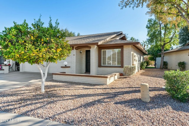 2064 S Farnsworth Dr Unit 39, Mesa, AZ 85209 - ranch-style house with concrete driveway, a shingled roof, a garage, and brick siding