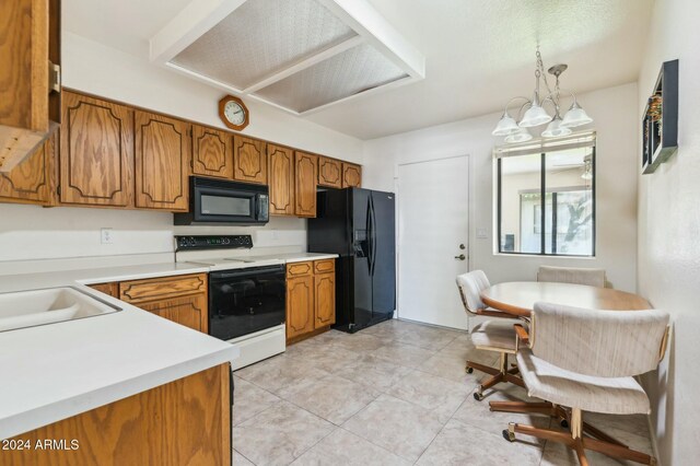 2064 S Farnsworth Dr Unit 39, Mesa, AZ 85209 - kitchen featuring black appliances, brown cabinetry, light countertops, and a chandelier