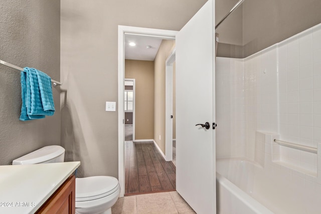 full bathroom with vanity, tub / shower combination, tile patterned floors, and toilet