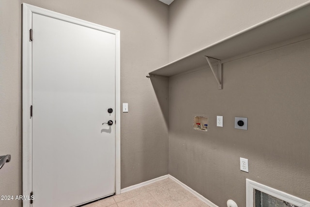 clothes washing area featuring hookup for an electric dryer, hookup for a washing machine, and light tile patterned floors