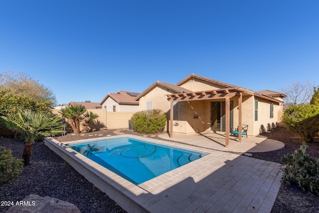 view of swimming pool featuring a pergola and a patio area