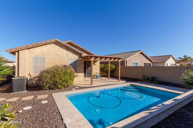 view of swimming pool with central AC and a patio area