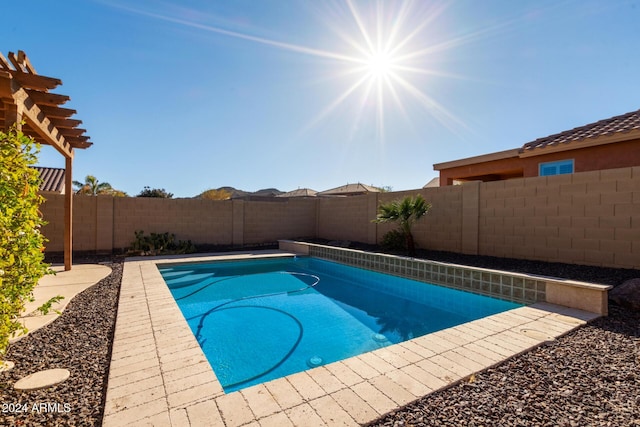 view of swimming pool featuring a pergola