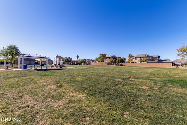 view of yard with a playground and a gazebo