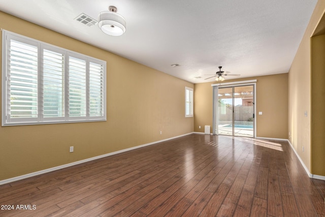 empty room featuring wood-type flooring and ceiling fan