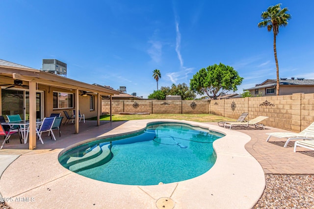 view of swimming pool with a patio, a ceiling fan, a fenced backyard, and a fenced in pool