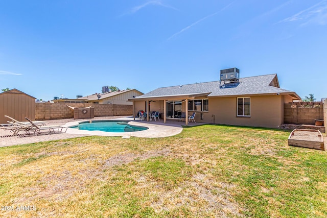 rear view of property with a shingled roof, a fenced backyard, central air condition unit, a patio, and a yard