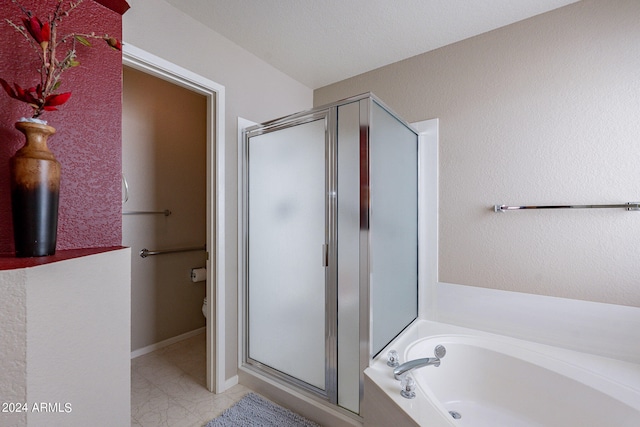 bathroom featuring separate shower and tub