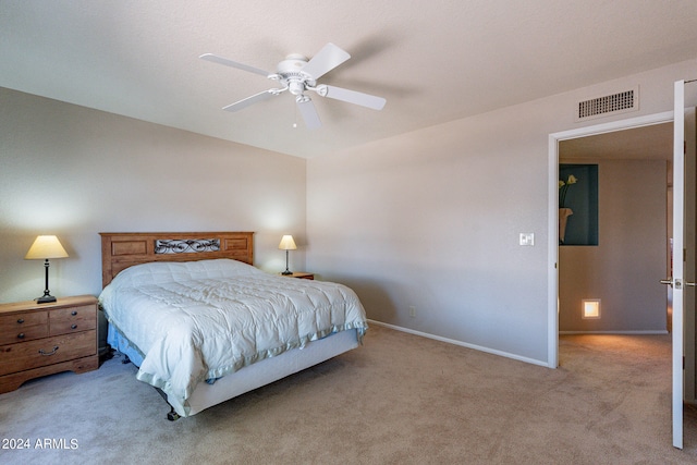 bedroom featuring light colored carpet and ceiling fan