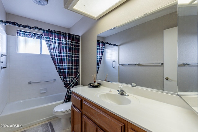 full bathroom with vanity, shower / tub combo, and toilet