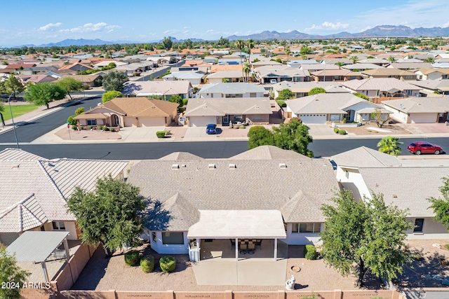 birds eye view of property featuring a mountain view